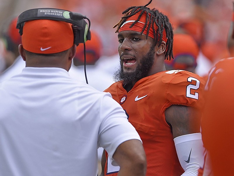 Clemson quarterback Kelly Bryant talks to a coach on the sideline during the Tigers' 48-7 win against Furman on Sept. 1. Bryant said he plans to transfer after being demoted from starter to backup of freshman Trevor Lawrence.