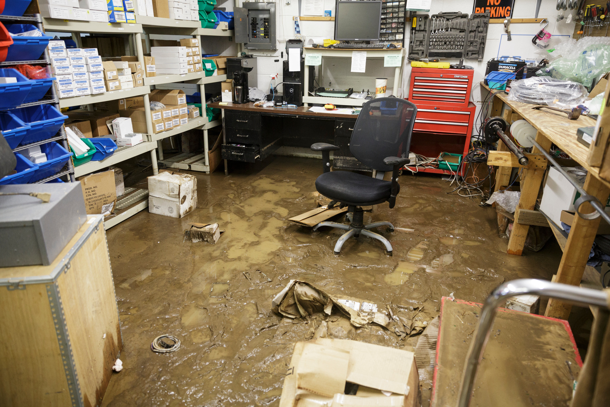 Mud coats the floor of Gatekeepers Inc. one day after a deadly flash flood in the Depot Street area on Thursday, Sept. 27, 2018, in Soddy-Daisy, Tenn. Residents, volunteers and business owners returned Thursday following the flooding which killed one person Wednesday.