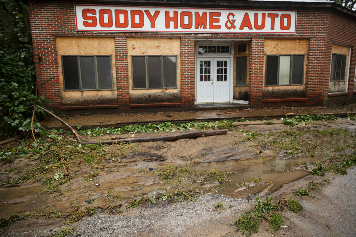 Mud collects in front of Soddy Home & Auto one day after a deadly flash flood in the Depot Street area on Thursday, Sept. 27, 2018, in Soddy-Daisy, Tenn. Residents, volunteers and business owners returned Thursday following the flooding which killed one person Wednesday.