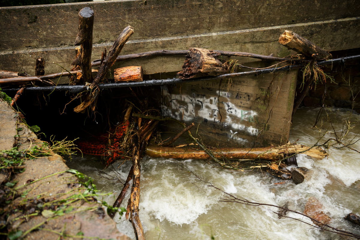 Debris clogs a bridge over Little Soddy Creek one day after a deadly flash flood in the Depot Street area on Thursday, Sept. 27, 2018, in Soddy-Daisy, Tenn. Residents, volunteers and business owners returned Thursday following the flooding which killed one person Wednesday.