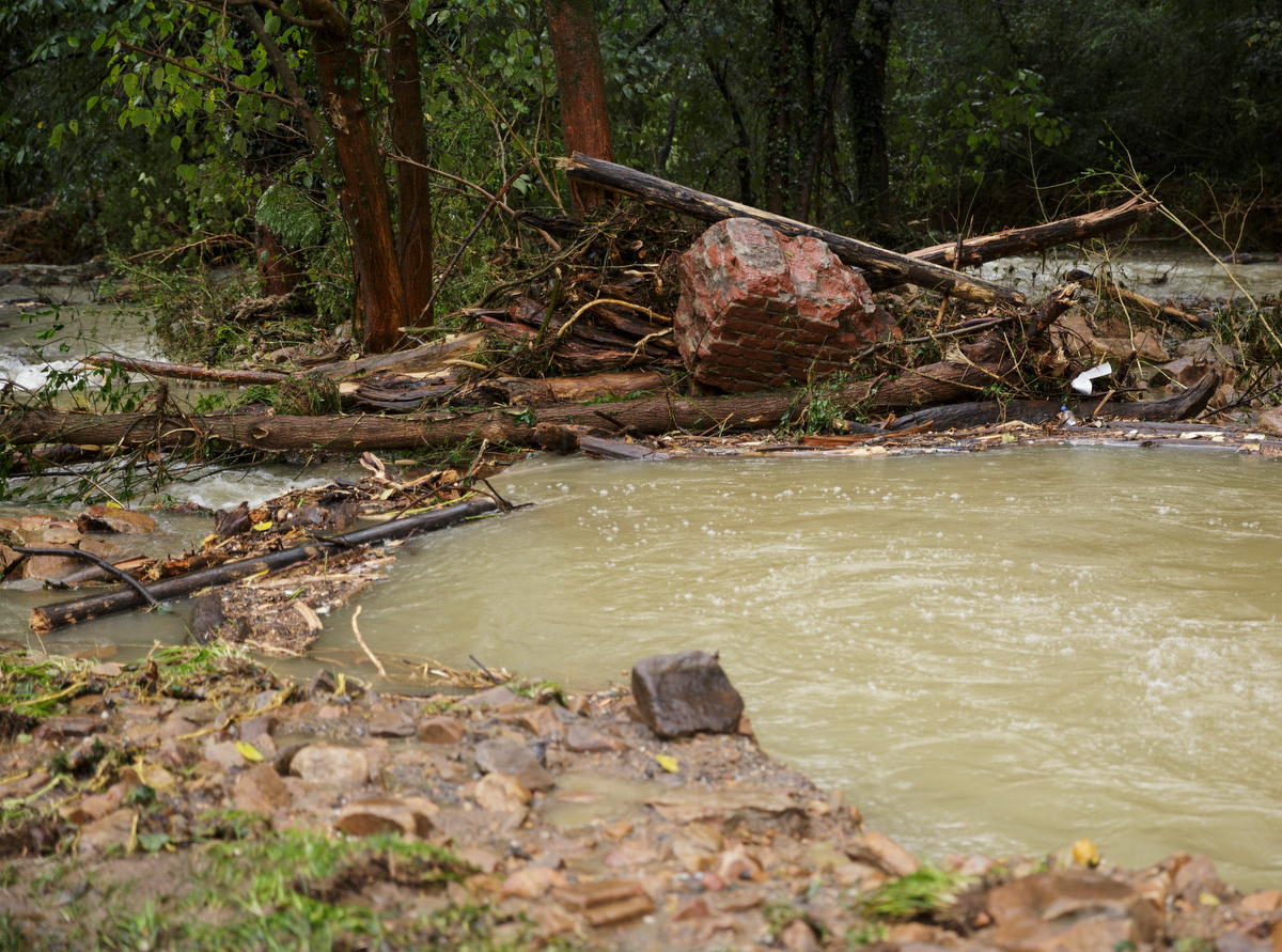 Little Soddy Creek is choked with debris one day after a deadly flash flood in the Depot Street area on Thursday, Sept. 27, 2018, in Soddy-Daisy, Tenn. Residents, volunteers and business owners returned Thursday following the flooding which killed one person Wednesday.