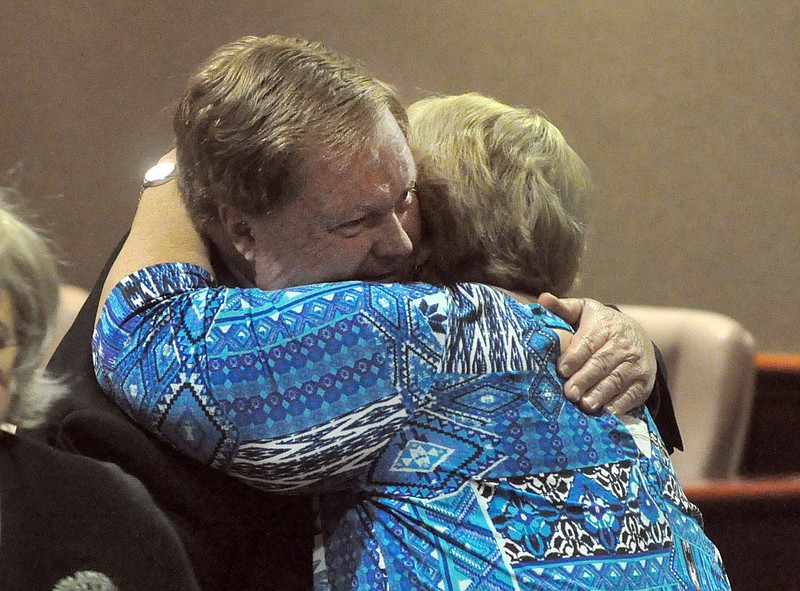 Chris Whitfield/Daily Citizen-News /
Conasauga Judicial Circuit District Attorney's Office Investigator Glenn Swinney, left, hugs Mary Mealer after a jury in Whitfield County Superior Court returns a verdict of guilty on a voluntary manslaughter charge against Jay Thomas Burlison on Thursday morning. Mealer testified that she saw Burlison, her ex husband, murder Ernest Griffin in November 1984 before Burlison disappeared for 34 years.