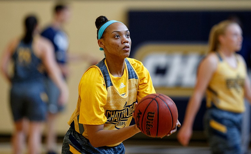 UTC guard Nakeia Burks lines up a shot during practice Thursday at the Chattem Basketball Practice Facility on campus.