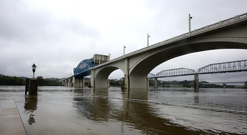 Water is up to the second step of The Passage along the Tennessee River Thursday, September 27, 2018 in Chattanooga, Tennessee. The area is typically a spot onlookers watch swimmers make their way to the bike portion of the Ironman Chattanooga race; however, the swim portion will be canceled this year due to flooding, which have caused dangerous conditions for swimmers.