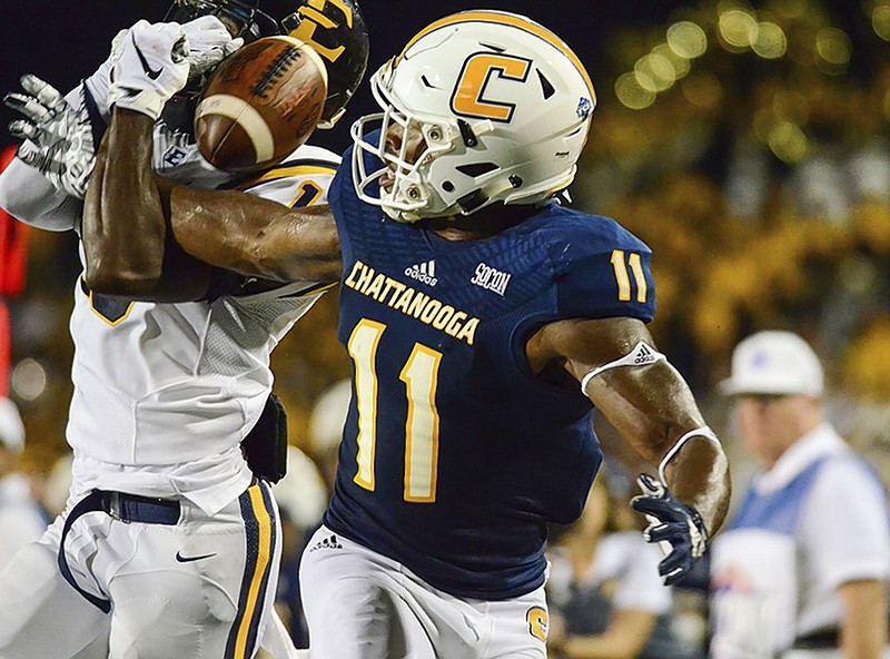 UTC wide receiver Will Young drops a deep pass during Saturday night's game against ETSU in Johnson City, Tenn.