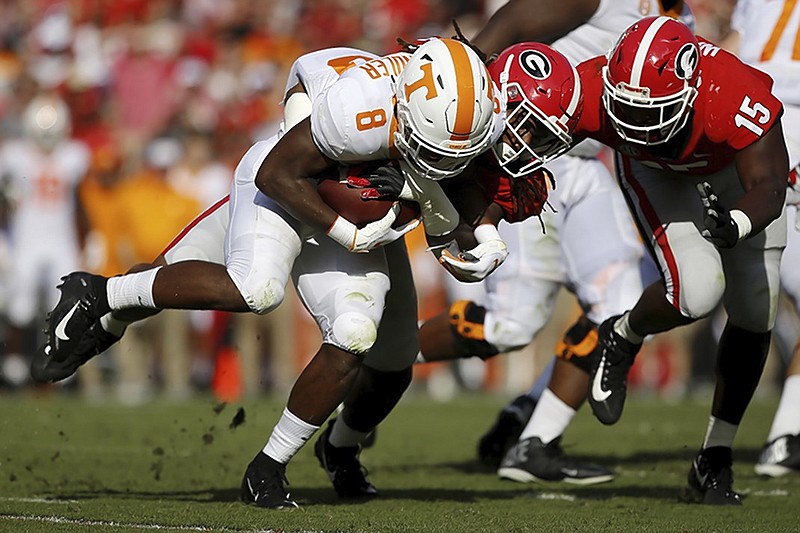 Tennessee sophomore running back Ty Chandler is unable to escape the grasp of Georgia linebacker Keyon Richardson during Saturday's game in Athens, Ga. The Vols are off this week before facing Alabama and Auburn in back-to-back games.