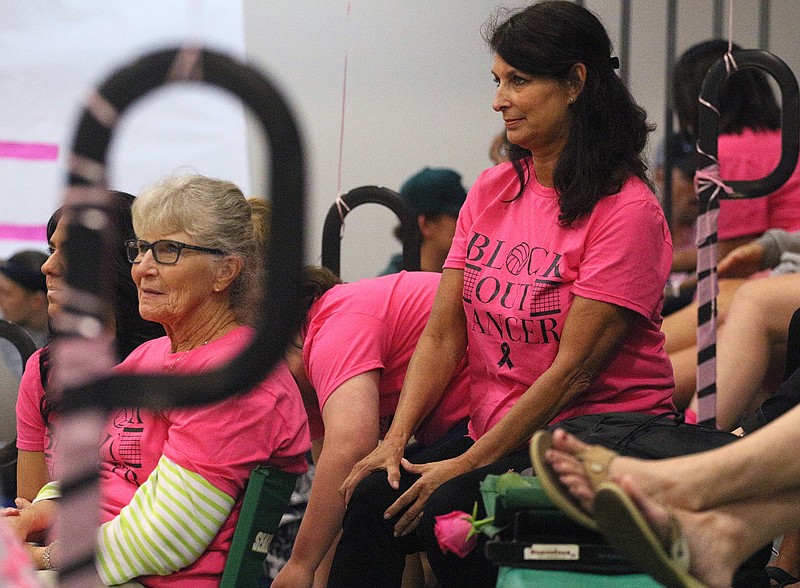 Sandy Woolweaver and Terri Bateman watch the Silverdale vs. Red Bank volleyball match. Both wore "Block Out Cancer" shirts for the event.