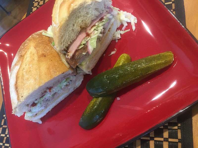 This was a tasty, fall-inspired sandwich with roasted pork tenderloin, Black Forest ham, sliced apple, Camembert and bacon jam on a toasted sandwich roll.