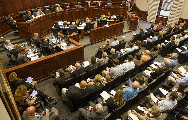 People gather to listen as the Hamilton County Commission discusses Resolution Number 1018-14, which was a proposal to set aside $3 million in bond money to purchase land off of Mahan Gap Road for a wastewater treatment plant, at the Hamilton County Courthouse on Wednesday, Oct. 3, 2018, in Chattanooga, Tenn.