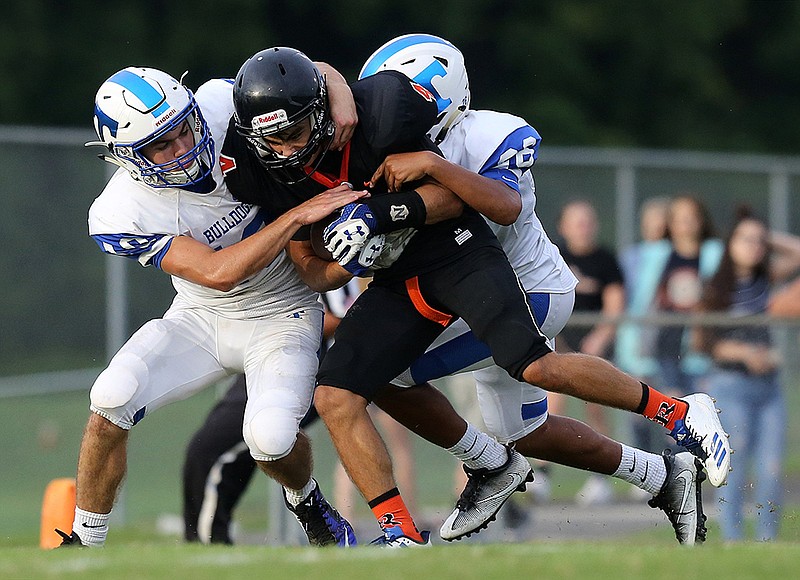 Trion's Hagen Willingham, left, helps bring down LaFayette's Austin Rogers during a scrimmage in August. Willingham has been an impact player for the Bulldogs on offense, defense and special teams this season.