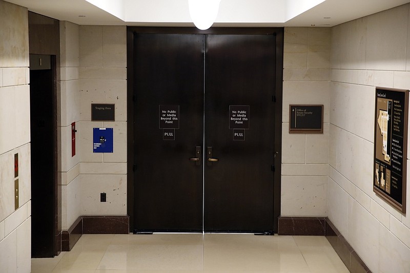 The entrance to the Office of Senate Security is seen on Capitol Hill, Wednesday night, Oct. 3, 2018, in Washington. (AP Photo/Alex Brandon)
