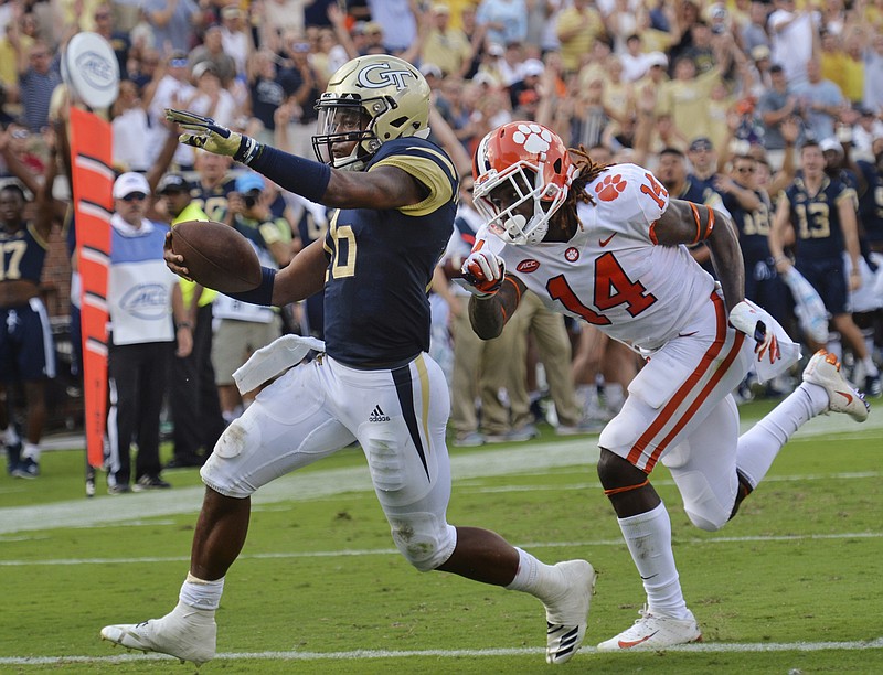 Georgia Tech senior quarterback TaQuon Marshall runs past Clemson safety Denzel Johnson for a touchdown during their Sept. 22 game in Atlanta. The Yellow Jackets avoided a fourth straight loss and their worst start since 1994 by beating Bowling Green last Saturday, and tonight they'll try to climb out of the ACC Coastal Division by earning their first league win of the season.