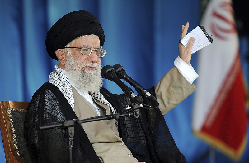 In this picture released by official website of the office of the Iranian supreme leader, Supreme Leader Ayatollah Ali Khamenei gestures while speaking during a gathering of thousands of members of the Basij, an all-volunteer force under paramilitary Revolutionary Guard, at the Azadi stadium in Tehran, Iran, last Thursday. Khamenei said the Islamic Republic will "slap" the United States by defeating new American sanctions targeting the nation. (Office of the Iranian Supreme Leader via AP)