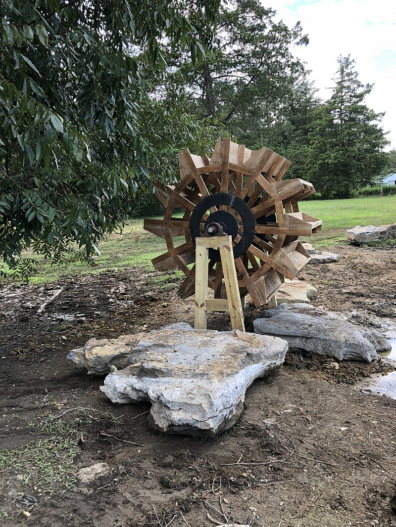 Once used to help boats get to the top of the Boat Chute water ride at Lake Winnepesaukah, the original wooden water wheel has now found a home at the Goodlet Farm in Rock Spring. (Contributed photo)