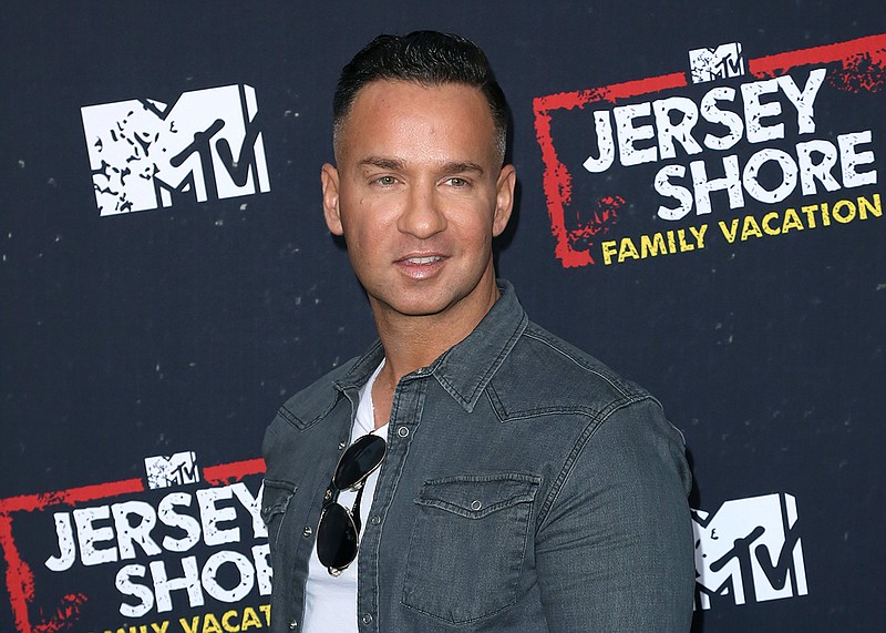 In this March 29, 2018 file photo, Mike "The Situation" Sorrentino arrives at the "Jersey Shore Family Vacation" premiere in Los Angeles. Sorrentino is seeking probation when he's sentenced Friday on tax charges, while prosecutors want a sentence of 14 months. Sorrentino pleaded guilty in January to concealing his income in 2011 by making cash deposits that wouldn't trigger federal reporting requirements. He and his brother were charged in 2014 with multiple tax offenses related to nearly $9 million in income. (Photo by Willy Sanjuan/Invision/AP, File)