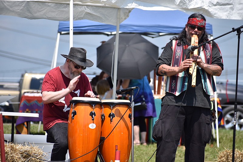 Keith Talley and Jack "Flute" Holland perform as Crazy Flute during a Fathers' Day powwoe in Dickson County, Tennessee.