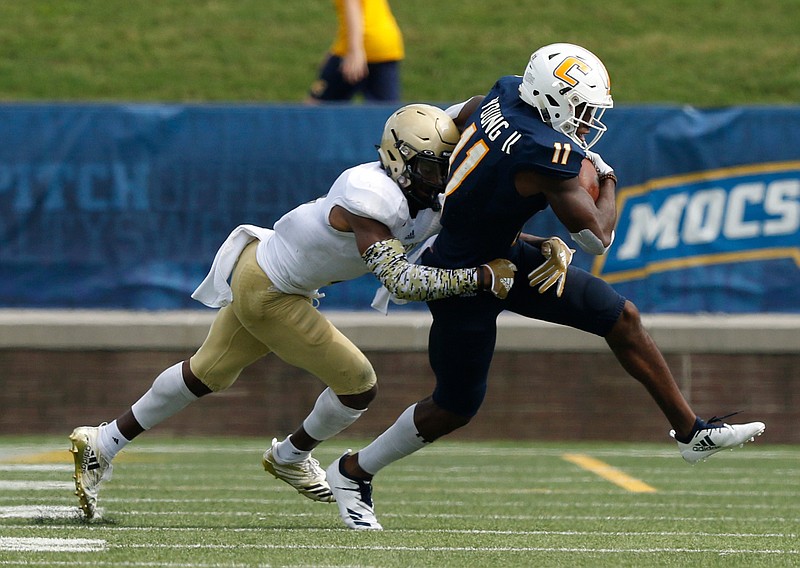 Wofford safety JoJo Tillery tackles UTC wide receiver Wil Young during Saturday's SoCon game at Finley Stadium.