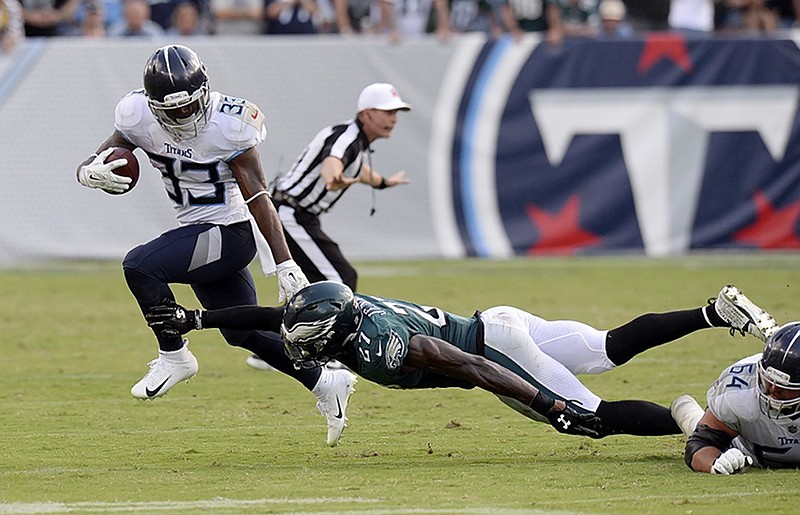 Tennessee Titans running back Dion Lewis gets past Philadelphia Eagles defensive back Malcolm Jenkins during overtime of the Titans' home win last Sunday.