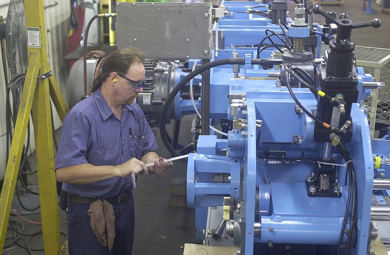 In this 2000 staff file photo, Edro Harris assembles a side matcher machine at the Hasko Machinery Co. plant in Red Bank before the facility moved to Soddy-Daisy Industrial Park.