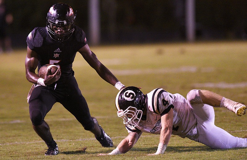 North Jackson's Lee Witherspoon (5) avoids the tackle of Scottsboro's Coleman Johnson (4).  The North Jackson Chiefs hosted the Scottsboro Wildcats in a rivalry game on September 28, 2018.  