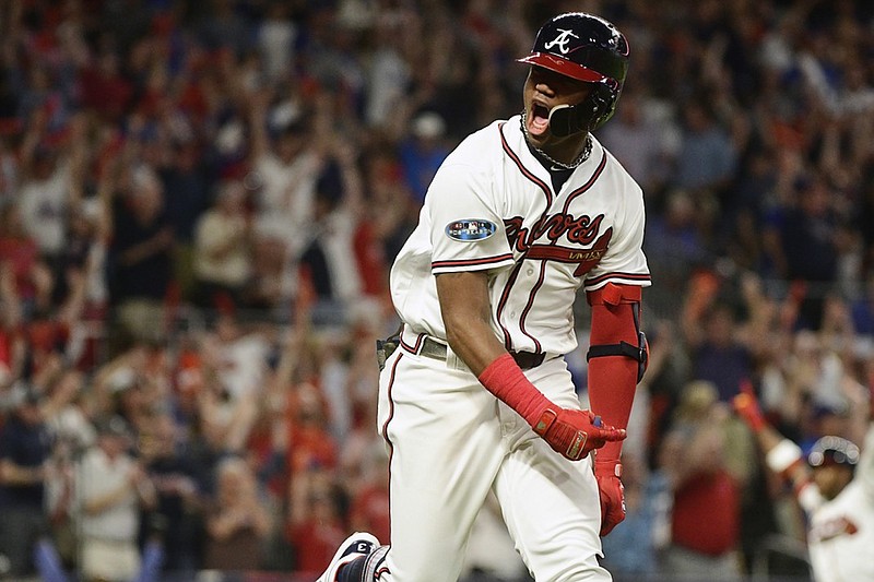 The Atlanta Braves' Ronald Acuna Jr. rounds the bases after hitting a grand slam Sunday night during Game 3 of the NL Division Series against the Los Angeles Dodgers in Atlanta.