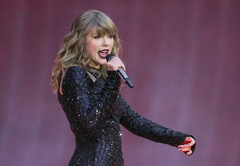 In this June 22, 2018, file photo, singer Taylor Swift performs on stage in concert at Wembley Stadium in London. Swift posted on Instagram Sunday, Oct. 7, that she's voting for Tennessee's Democratic Senate candidate Phil Bredesen, breaking her long-standing refusal to discuss anything politics. (Photo by Joel C Ryan/Invision/AP, File)