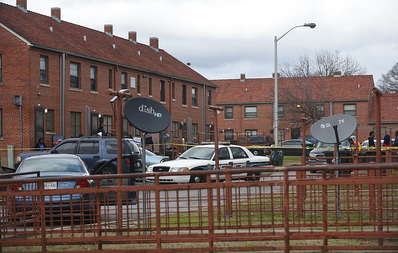 Officers investigate Sunday, January 22, 2017 in East Lake Courts after they were dispatched to a person shot call on 6th Avenue. 