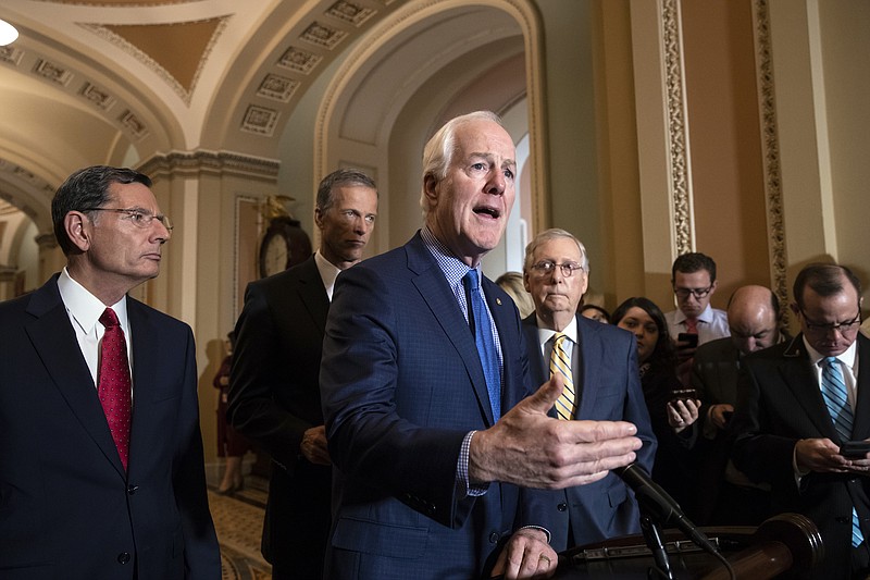 Senate Majority Whip John Cornyn, R-Texas, joined by, from left, Sen. John Barrasso, R-Wyoming, Sen. John Thune, R-Sourth Dakota, and Senate Majority Leader Mitch McConnell, R-Kentucky, speaks to reporters about the political battle for confirmation of President Donald Trump's Supreme Court nominee, Brett Kavanaugh, following a closed-door GOP policy meeting, at the Capitol in Washington on Oct. 2. (AP Photo/J. Scott Applewhite)