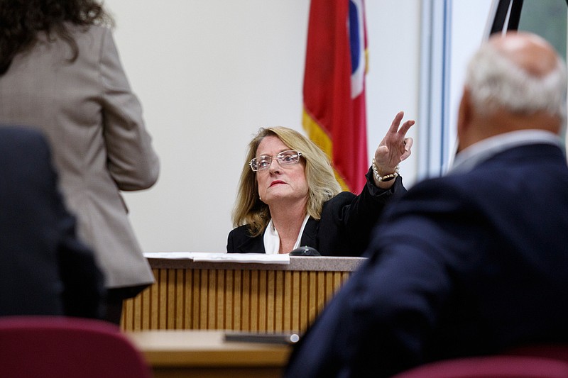 John Shackleford, right, listens as Catherine White testifies during a trial at the Hamilton County-Chattanooga Courts Building on Tuesday, Oct. 9, 2018, in Chattanooga, Tenn. White, a former Hamilton County judicial candidate, sued Schackleford in a dispute over campaign signs which Shackleford was contracted to distribute.