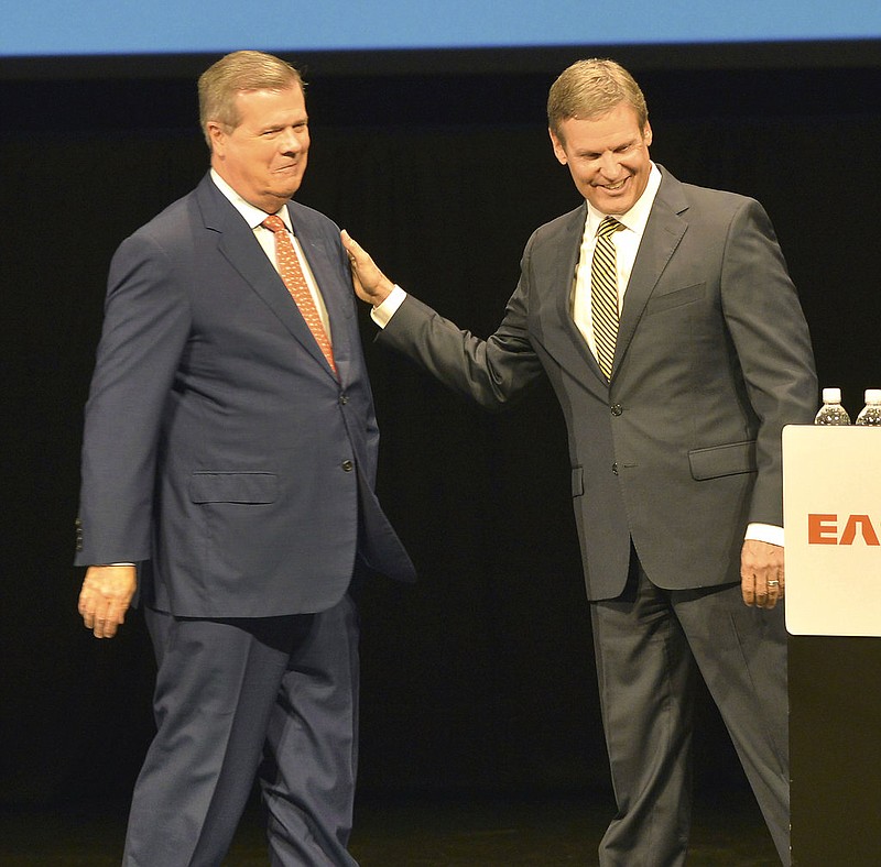 Tennessee gubernatorial candidates, Democrat Karl Dean, left, and Republican Bill Lee greet one another at the beginning of their debate at the Toy R. Reid Employee Center at Tennessee Eastman, Tuesday, Oct. 9, 2018, in Kingsport, Tenn. (David Crigger/The Bristol Herald-Courier via AP)