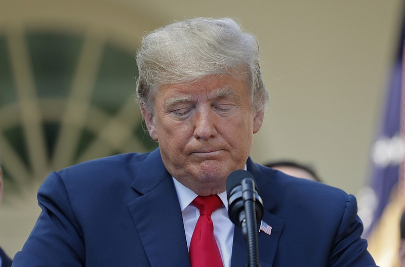 President Donald Trump pauses while he takes questions on a revamped North American free trade deal, in the Rose Garden of the White House in Washington, Monday, Oct. 1, 2018. The new deal, reached just before a midnight deadline imposed by the U.S., will be called the United States-Mexico-Canada Agreement, or USMCA. It replaces the 24-year-old North American Free Trade Agreement, which President Donald Trump had called a job-killing disaster. (AP Photo/Pablo Martinez Monsivais)