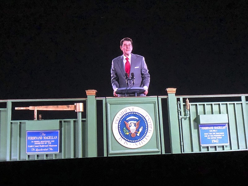 Former President Ronald Reagan appears on a railcar platform making a speech during a whistle stop on the campaign trail, but as a hologram, on display at the Ronald Reagan Presidential Library in Simi Valley, Calif., Wednesday, Oct. 10, 2018. The Reagan Library says it worked with the same Hollywood special effects wizards who helped bring singers Michael Jackson, Maria Callas and Roy Orbison back to life on stage. Officials say the goal is to allow visitors to see Reagan back in the Oval Office, campaigning or at his beloved ranch. (AP Photo/Amanda Lee Myers)

