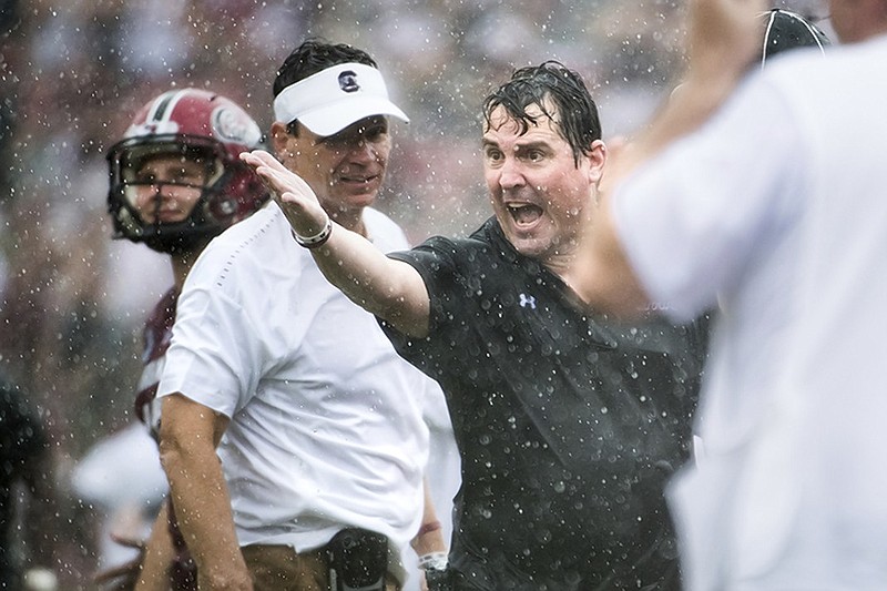 South Carolina football coach Will Muschamp shouts at an official during last week's rain-soaked win against Missouri in Columbia, South Carolina.