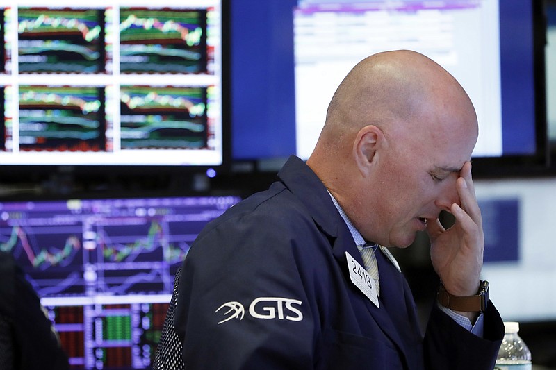 Specialist John O'Hara works on the floor of the New York Stock Exchange, Thursday, Oct. 11, 2018. Stocks are slumping for a second straight day as the market endures its most volatile stretch since February. (AP Photo/Richard Drew)