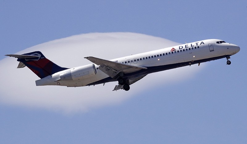 In this May 24, 2018, file photo a Delta Air Lines passenger jet plane, a Boeing 717-200 model, approaches Logan Airport in Boston. Delta Air Lines Inc. (DAL) on Thursday, Oct. 11, 2018, reported third-quarter earnings of $1.31 billion. (AP Photo/Charles Krupa, File)