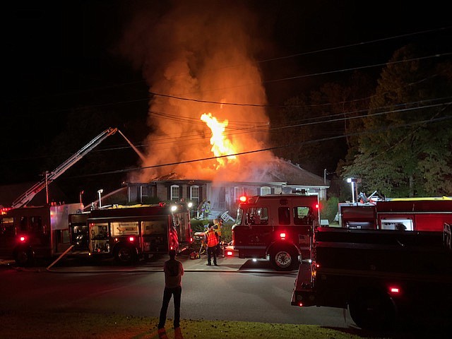 Firefighters battle a fire in the Hidden Harbor subdivision on Thursday, Oct. 11, 2018.