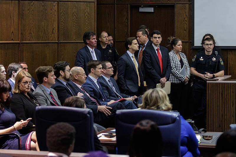 Attorneys fill the courtroom before the arraignment of alleged gang members in Judge Tom Greenholtz's courtroom in the Chattanooga-Hamilton County Courts Building on Friday, April 27, 2018, in Chattanooga, Tenn. 45 of the alleged Athens Park Blood gang members indicted last month on RICO charges were arraigned Friday.