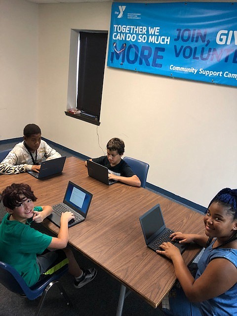 Braxton Austin-Cook, Ramekio Rachel, Malachi Shavers and Heaven Parkman participate in improvement activities provided by Link@TheY, which was formed last year to build students up academically, physically, socially and spiritually. (Contributed photo)