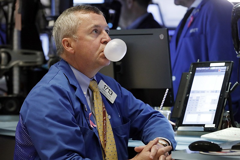 FILE- In this Oct. 10, 2018, file photo trader James Lamb watches his screens on the floor of the New York Stock Exchange. After a harrowing week for financial markets, investors will look for solid corporate earnings reports and healthy economic news next week to forestall any volatility. (AP Photo/Richard Drew, File)
