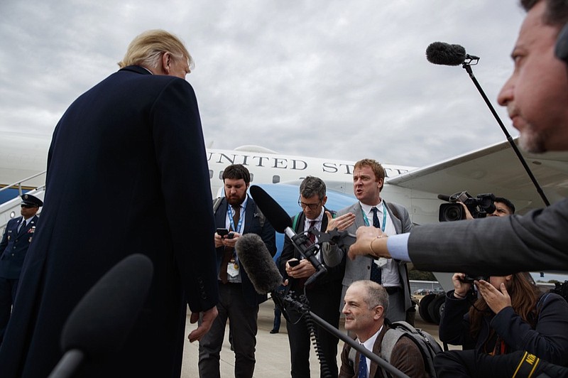 President Donald Trump listens to a question about the missing Saudi journalist Jamal Khashoggi after landing at Cincinnati Municipal Lunken Airport, Friday, Oct. 12, 2018, in Cincinnati, Ohio. (AP Photo/Evan Vucci)

