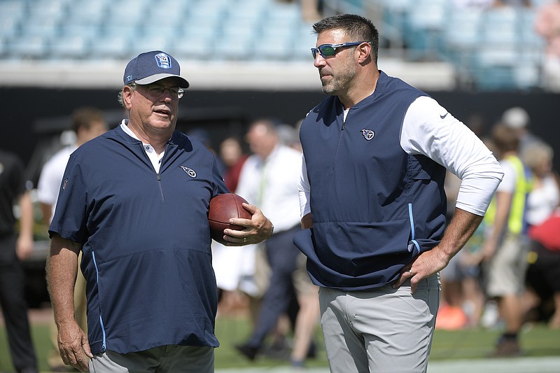 Tennessee Titans head coach Mike Vrabel, right, talks with defensive coordinator Dean Pees before their game against the Jacksonville Jaguars on Sept. 23.
