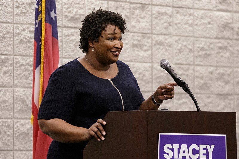 Staff photo by Doug Strickland / Democratic candidate for governor Stacey Abrams speaks during a town hall forum at the Dalton Convention Center on Wednesday, Aug. 1, 2018, in Dalton, Ga. Abrams is running against Republican candidate Brian Kemp in Georgia's November general election.
