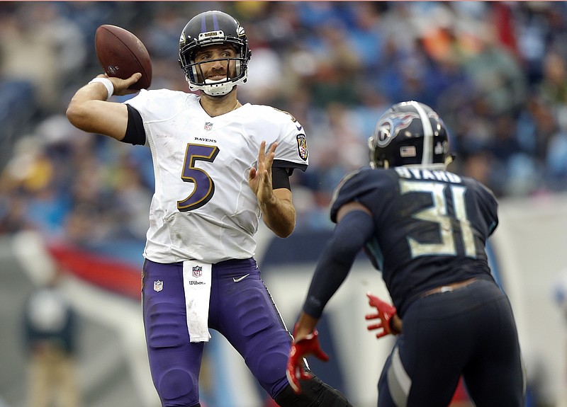 Baltimore Ravens quarterback Joe Flacco (5) passes as he is pressured by Tennessee Titans safety Kevin Byard (31) in the second half of an NFL football game Sunday, Oct. 14, 2018, in Nashville, Tenn. (AP Photo/Wade Payne)