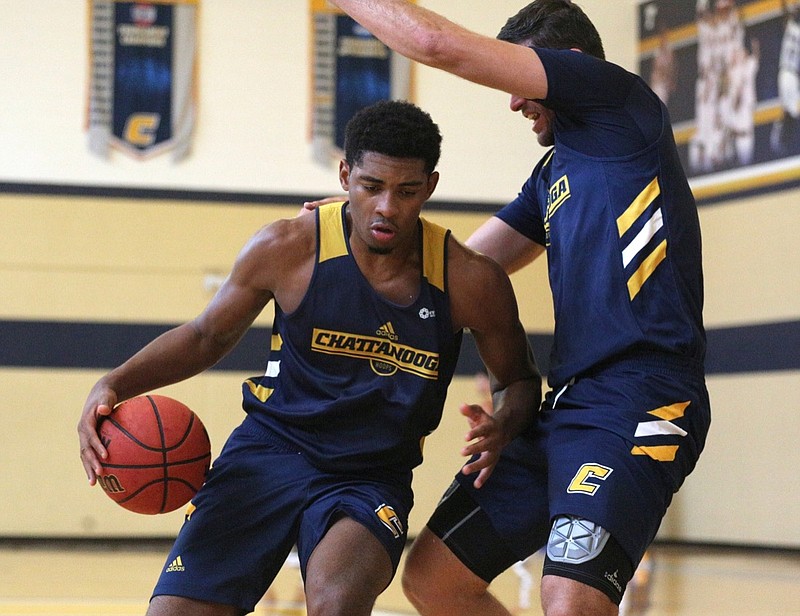 University of Tennessee at Chattanooga's Kevin Easley (34) works on drills with Ramon Vila (15) during practice Tuesday, Sept. 25, 2018, at the Chattem Basketball Practice Facility at the University of Tennessee at Chattanooga. Tuesday was the first day of practice.