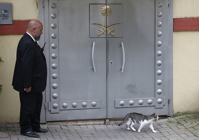 A security guard stands outside Saudi Arabia's Consulate in Istanbul on Monday. Turkey and Saudi Arabia are expected to conduct a joint "inspection" of the consulate, where Saudi journalist Jamal Khashoggi went missing nearly two weeks ago, Turkish authorities said. (AP Photo/Petros Giannakouris)