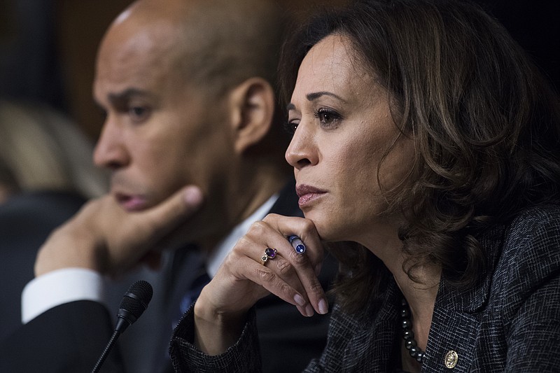 U.S. Sen. Cory Booker, D-New Jersey, and Sen. Kamala Harris, D-California, listen as Dr. Christine Blasey Ford testifies during the Senate Judiciary Committee hearing on the nomination of Brett M. Kavanaugh to be an associate justice of the Supreme Court of the United States, focusing on allegations of sexual assault by Kavanaugh against Christine Blasey Ford in the early 1980s. (Photo By Tom Williams/CQ Roll Call/POOL)