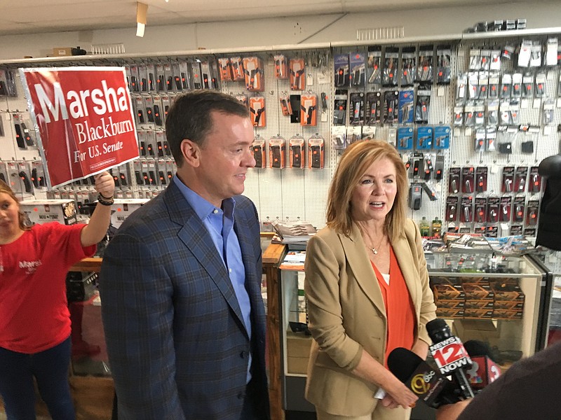 Chris Cox, left, chief lobbyist for the National Rifle Association, campaigns with U.S. Rep. Marsha Blackburn at a Harrison gun shop Monday. Blackburn is the GOP candidate in the Tennessee race for U.S. Senate.