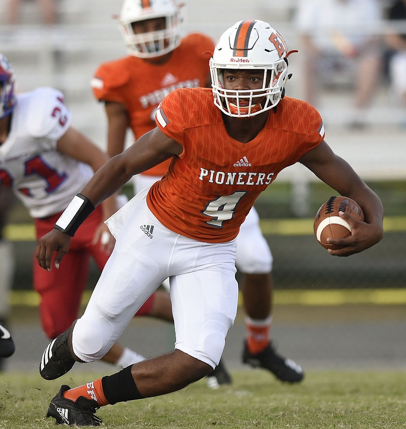 Alonzo Russell (4) runs for the Pioneers.  The East Ridge Pioneers hosted the Polk County Wildcats in TSSAA football action on August 14, 2018.  