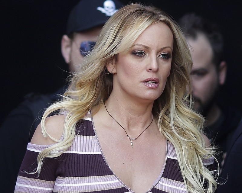  In this Thursday, Oct. 11, 2018, file photo, adult film actress Stormy Daniels arrives for the opening of the adult entertainment fair "Venus," in Berlin. On Monday, Oct. 15, 2018, a federal judge dismissed Daniels' defamation lawsuit against President Donald Trump. (AP Photo/Markus Schreiber, File)