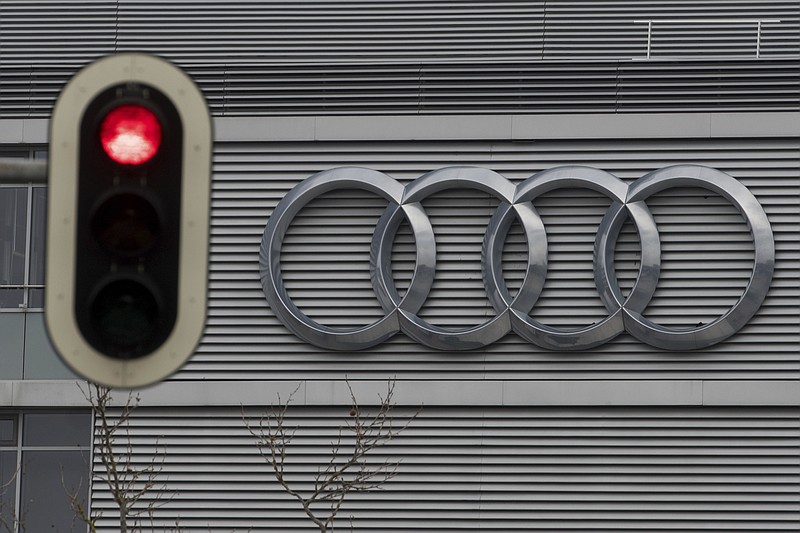 FILE -- In this Wednesday, March 15, 2017 photo a traffic sign shows a red light in front of the Audi headquarters in Ingolstadt, Germany.  Audi accepted a fine of 800 million euro (927 million US$) for it's involvement in the Diesel scandal. (Armin Weigel/dpa via AP, file)